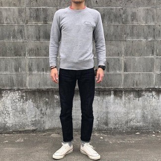 500+ Spring Outfits For Men: Choose a grey sweatshirt and black jeans to put together a cool and casual ensemble. We're totally digging how cohesive this outfit looks when rounded off with a pair of white canvas low top sneakers. With springtime coming, it's time to make space for simple and dapper getups, just like this.