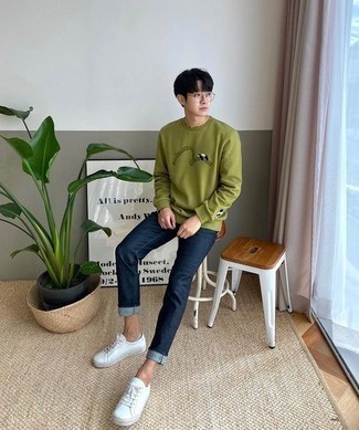 Olive Print Sweatshirt Outfits For Men: One of the most popular ways for a man to style an olive print sweatshirt is to team it with navy jeans for a casual getup. Opt for a pair of white leather low top sneakers and you're all set looking incredible.