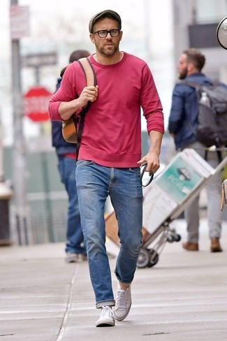 Ryan Reynolds wearing Red Sweatshirt, Blue Jeans, White Canvas Low Top Sneakers, Brown Leather Backpack