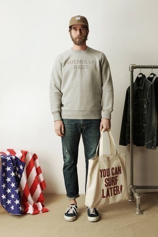 Tan Sweatshirt Outfits For Men: A tan sweatshirt and teal ripped jeans are a good combination to add to your daily casual routine. Introduce a pair of black and white canvas low top sneakers to your getup to completely jazz up the outfit.