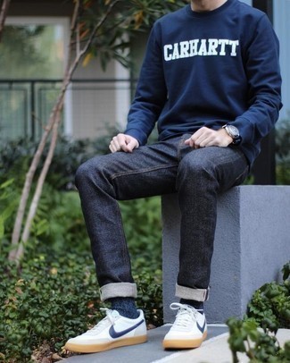 Navy and White Print Sweatshirt Outfits For Men: This laid-back combo of a navy and white print sweatshirt and navy jeans is super easy to throw together in no time, helping you look awesome and prepared for anything without spending a ton of time digging through your closet. A pair of white and navy leather low top sneakers is a good pick to finish off this look.