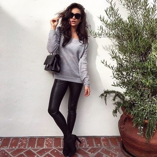 Shay Mitchell wearing Grey Sweatshirt, Black Leather Leggings, Black Suede Ankle Boots, Black Quilted Leather Satchel Bag