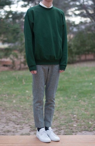 Dark Green Sweatshirt Outfits For Men: If you're hunting for a casual yet dapper outfit, dress in a dark green sweatshirt and grey wool chinos. Rock a pair of white leather low top sneakers and ta-da: the look is complete.