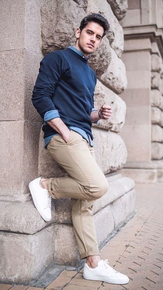 Navy Sweatshirt Outfits For Men: Showcase that you know a thing or two about men's style by opting for a navy sweatshirt and khaki chinos. When in doubt as to the footwear, stick to a pair of white leather low top sneakers.