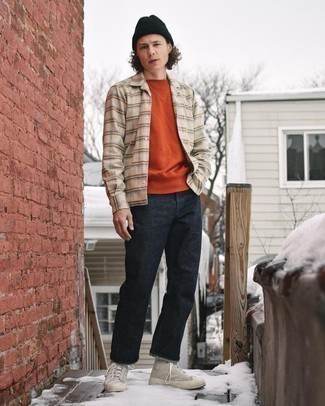 Orange Sweatshirt Outfits For Men: Pair an orange sweatshirt with charcoal jeans for a hassle-free look that's also put together. Finish off with a pair of grey canvas high top sneakers to punch up your getup.