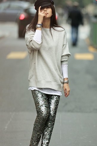 White and Black Long Sleeve T-shirt Outfits For Women: When the situation allows a laid-back ensemble, consider wearing a white and black long sleeve t-shirt and grey sequin skinny pants.