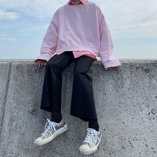 Pink Sweatshirt Outfits For Men: A pink sweatshirt and black chinos will introduce serious style into your current off-duty routine. Consider a pair of grey print canvas low top sneakers as the glue that will bring this ensemble together.