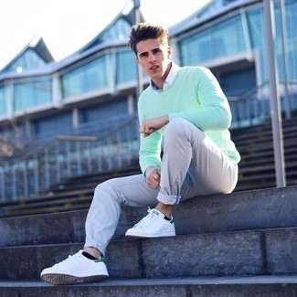 Mint Sweatshirt Outfits For Men: If you like classic combinations, then you'll like this combination of a mint sweatshirt and beige chinos. White and green canvas low top sneakers look awesome completing your ensemble.