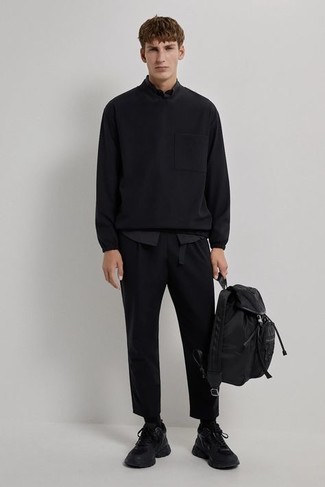 Black Canvas Belt Outfits For Men: A black sweatshirt and a black canvas belt are the kind of a never-failing casual getup that you so desperately need when you have no time. When in doubt as to what to wear when it comes to shoes, introduce a pair of black athletic shoes to your getup.
