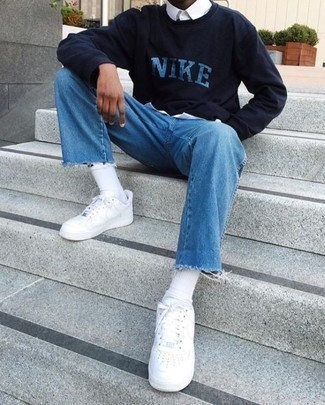 Navy and White Print Sweatshirt Outfits For Men: A navy and white print sweatshirt and blue jeans are a nice combination to have in your off-duty arsenal. As for shoes, throw white leather low top sneakers in the mix.
