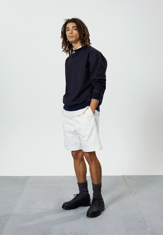 Navy Sweatshirt Outfits For Men: Fashionable and practical, this laid-back combo of a navy sweatshirt and white shorts will provide you with excellent styling possibilities. Unimpressed with this outfit? Enter black chunky leather derby shoes to switch things up.