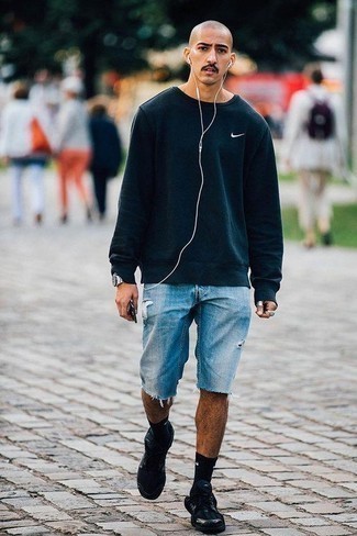 Black Sweatshirt Outfits For Men: Marry a black sweatshirt with light blue ripped denim shorts to pull together an interesting and contemporary outfit. Introduce black athletic shoes to the equation to make a standard outfit feel suddenly fresh.