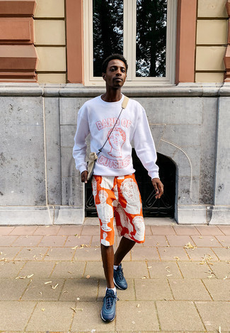 White Print Sweatshirt Outfits For Men: Consider wearing a white print sweatshirt and orange print shorts for a cool and relaxed and trendy look. Spice up your look by finishing off with navy and white athletic shoes.