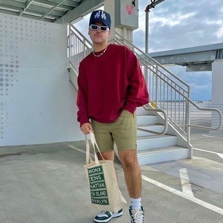 Beige Print Canvas Tote Bag Outfits For Men: A burgundy sweatshirt and a beige print canvas tote bag are a staple casual combo for many stylish gents. And if you want to immediately amp up your outfit with footwear, introduce white and green leather high top sneakers to the equation.
