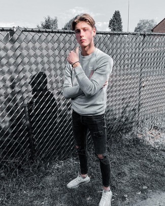 Black Skinny Jeans with Athletic Shoes Outfits For Men: For a look that's pared-down but can be manipulated in plenty of different ways, dress in a grey sweatshirt and black skinny jeans. Take a more laid-back approach with shoes and add a pair of athletic shoes to the equation.