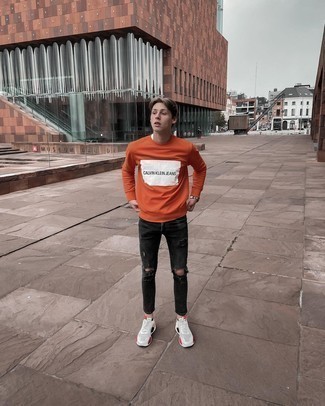 Orange Sweatshirt Outfits For Men: This casual combination of an orange sweatshirt and black ripped skinny jeans is simple, seriously stylish and super easy to copy. When not sure about what to wear when it comes to shoes, stick to a pair of white athletic shoes.