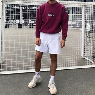 Purple Print Sweatshirt Outfits For Men: We all look for functionality when it comes to fashion, and this street style pairing of a purple print sweatshirt and white sports shorts is a perfect example of that. Beige athletic shoes are a nice pick to round off your look.