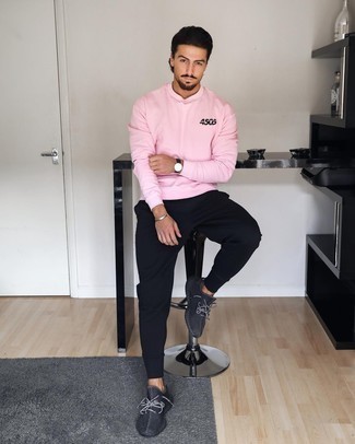 Pink Sweatshirt Outfits For Men: A pink sweatshirt and black sweatpants are the kind of a fail-safe casual look that you so awfully need when you have zero time to dress up. A pair of charcoal athletic shoes brings a more dressed-down aesthetic to the look.