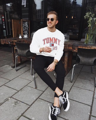White Print Sweatshirt Outfits For Men: Putting together a white print sweatshirt with black sweatpants is an on-point pick for a casual outfit. Dress up this look with the help of a pair of black and white canvas low top sneakers.