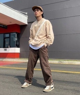 Brown Chinos Outfits: Flaunt your skills in men's fashion by wearing this off-duty combo of a beige sweatshirt and brown chinos. Kick up the fashion factor of this getup by wearing white leather high top sneakers.