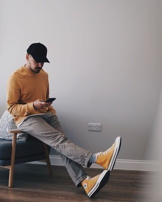 Grey Socks Outfits For Men: Such pieces as a tan sweatshirt and grey socks are the ideal way to inject some cool into your off-duty styling routine. Give a different twist to this outfit by sporting a pair of orange canvas high top sneakers.
