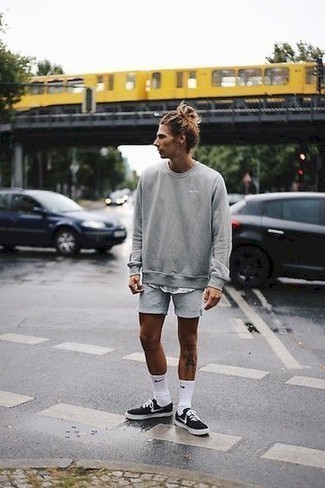 Grey Sports Shorts Outfits For Men: For a casual and cool outfit, marry a grey sweatshirt with grey sports shorts — these items fit really great together. A pair of black and white canvas low top sneakers will bring a classic aesthetic to the getup.