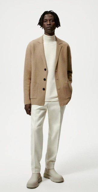 Blazer Outfits For Men: Pairing a blazer with white chinos is an on-point pick for an effortlessly smart getup. Wondering how to complement your getup? Rock a pair of beige suede chelsea boots to amp up the style factor.
