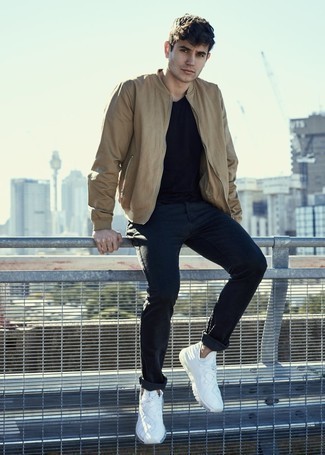 Tan Bomber Jacket Outfits For Men: To achieve a casual outfit with a twist, try pairing a tan bomber jacket with navy jeans. To introduce a sense of stylish effortlessness to your ensemble, add a pair of white athletic shoes to the mix.