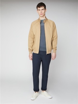 Tan Bomber Jacket Outfits For Men In Their Teens: Reach for a tan bomber jacket and navy chinos to put together a casually cool look. If you need to immediately dial down this look with one single item, complete this outfit with beige leather low top sneakers. Just because you're an adolescent, doesn't mean you can't dress fashionably, and this combination proves exactly that.