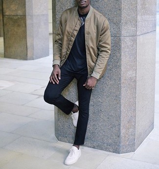 Tan Satin Bomber Jacket Outfits For Men: For a look that's very easy but can be worn in a multitude of different ways, pair a tan satin bomber jacket with navy chinos. On the shoe front, go for something on the relaxed end of the spectrum and complement this ensemble with white canvas low top sneakers.