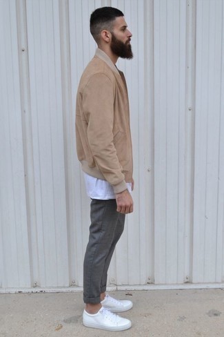Beige Bomber Jacket Outfits For Men: A beige bomber jacket and grey chinos make for the ultimate casual ensemble for today's guy. Feeling creative? Change things up a bit by slipping into a pair of white leather low top sneakers.