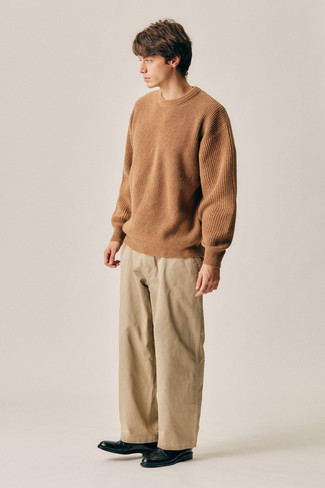 Beige Crew-neck Sweater Outfits For Men: This pairing of a beige crew-neck sweater and khaki chinos is ideal for most casual settings. A pair of black leather derby shoes easily steps up the style factor of your getup.