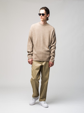 Tan Crew-neck Sweater Outfits For Men: When comfort is prized, this pairing of a tan crew-neck sweater and khaki chinos is a winner. For a more relaxed take, add white leather low top sneakers to the equation.