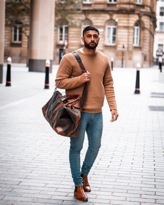 Tobacco Leather Chelsea Boots Outfits For Men: Dress in a tan crew-neck sweater and light blue jeans for a sharp, casual outfit. For a smarter take, why not complete your ensemble with tobacco leather chelsea boots?