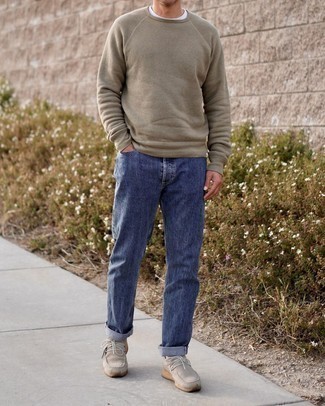 Beige Crew-neck Sweater Outfits For Men: Marry a beige crew-neck sweater with navy jeans for a functional outfit that's also well put together. All you need is a pair of beige suede desert boots to finish off your look.