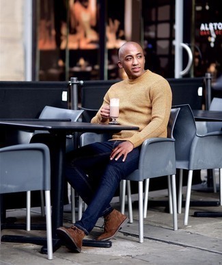 Tan Sweater Outfits For Men: This pairing of a tan sweater and navy jeans is definitive proof that a simple casual look doesn't have to be boring. Hesitant about how to complement your ensemble? Rock brown suede desert boots to amp up the classy factor.