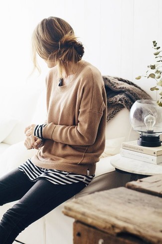 A tan crew-neck sweater looks especially cool when worn with black skinny jeans.
