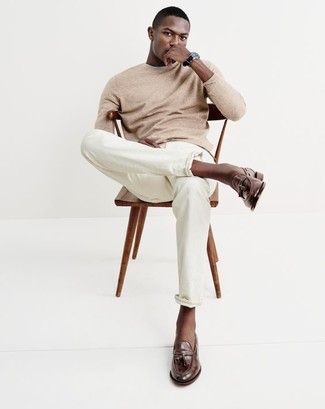 Brown Leather Tassel Loafers Outfits: Channel your inner cool-kid and opt for a tan crew-neck sweater and white chinos. Brown leather tassel loafers are a surefire way to give a touch of polish to your look.