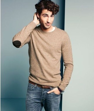 Try pairing a tan crew-neck sweater with blue jeans to pull together a truly sharp and modern-looking off-duty outfit.