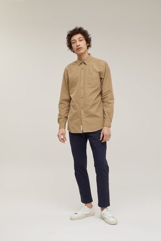Tan Long Sleeve Shirt Outfits For Men: This combo of a tan long sleeve shirt and navy chinos is extremely easy to pull together and so comfortable to wear over the course of the day as well! To inject a more relaxed vibe into your look, introduce a pair of white canvas low top sneakers to the mix.