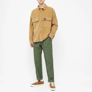 Dark Brown Canvas Low Top Sneakers Outfits For Men: Consider pairing a tan long sleeve shirt with olive chinos to pull together a really sharp and current laid-back ensemble. A pair of dark brown canvas low top sneakers effortlessly ramps up the street cred of this ensemble.