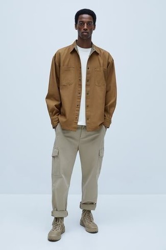 Beige Cargo Pants Outfits: Marry a tan long sleeve shirt with beige cargo pants if you wish to look casually stylish without much effort. Complement this outfit with tan canvas work boots to keep the getup fresh.