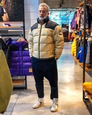 Men's Tan Puffer Jacket, Navy Chinos, White and Black Leather High Top Sneakers, Clear Sunglasses