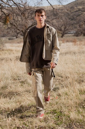 Tan Shirt Jacket Outfits For Men: This pairing of a tan shirt jacket and khaki cargo pants spells comfort and relaxed dapperness. Send an otherwise traditional outfit a more casual path by wearing a pair of red canvas low top sneakers.