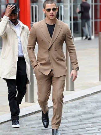 Nick Jonas wearing Tan Suit, Black Crew-neck T-shirt, Black Leather Chelsea Boots