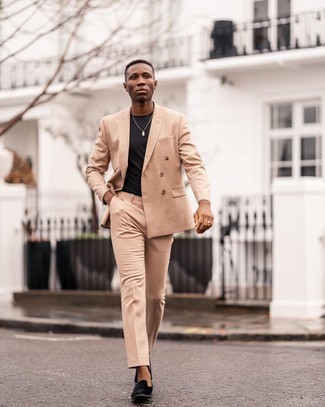 Tan Suit Outfits: This combination of a tan suit and a black crew-neck t-shirt looks neat and makes you look infinitely cooler. Black velvet loafers are an effortless way to bring a dose of sophistication to this outfit.