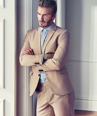 A tan suit and a light blue dress shirt are an elegant combo that every dapper gentleman should have in his wardrobe.