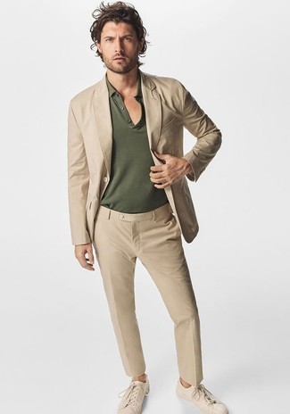 Dark Green Polo Outfits For Men: We love the way this semi-casual pairing of a dark green polo and a tan suit immediately makes men look stylish. A pair of beige canvas low top sneakers immediately ups the street cred of this ensemble.
