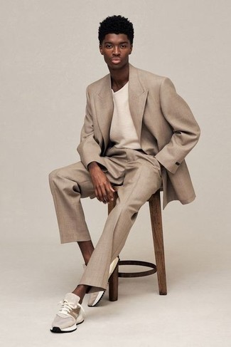 Tan Suit Outfits: Bring your casual style A-game by opting for this combination of a tan suit and a white crew-neck t-shirt. Finish off your ensemble with beige athletic shoes to serve a little mix-and-match magic.