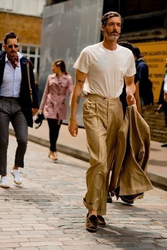Tan Suit Outfits: You'll be surprised at how easy it is for any gentleman to pull together this casually neat look. Just a tan suit combined with a white crew-neck t-shirt. If you wish to instantly kick up this ensemble with one item, complete your look with dark brown suede loafers.